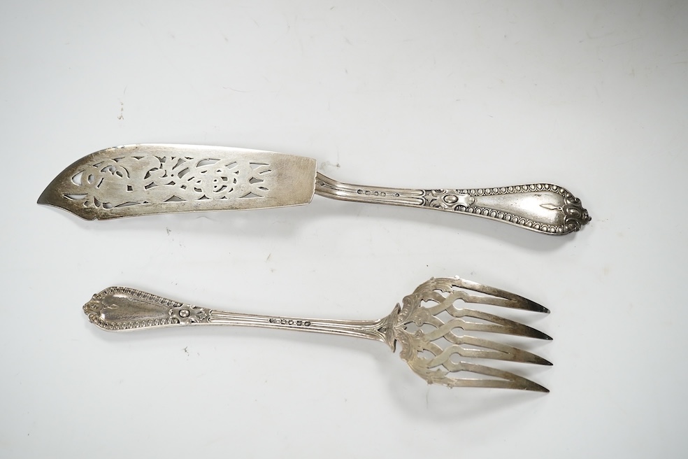 A cased pair of Victorian silver fish servers, by George Adams, indistinct marks, knife 32.7cm, 11oz. Condition - fair